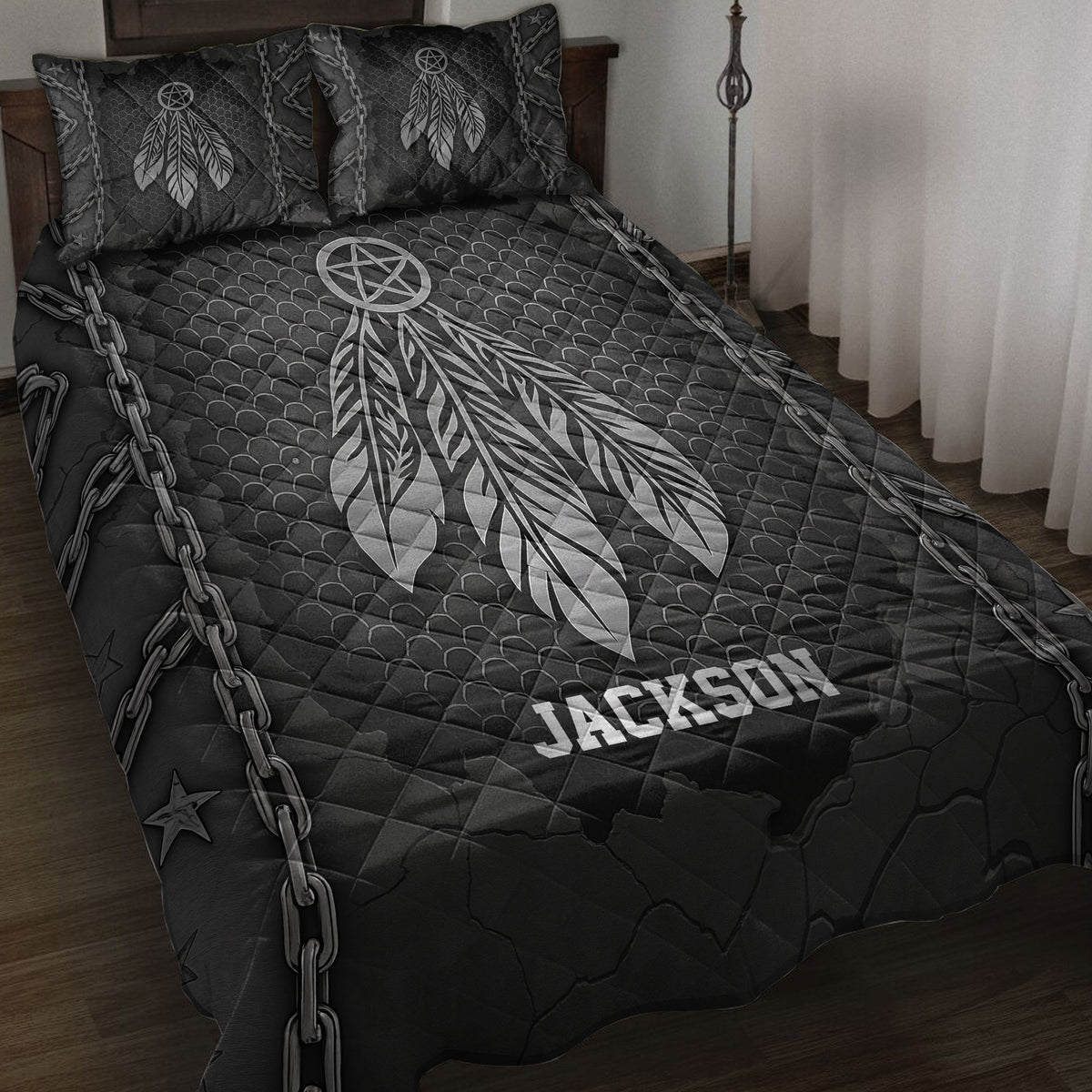 Dark Native American quilt blanket featuring a large feathered dreamcatcher, chains, stars, and textured black artwork