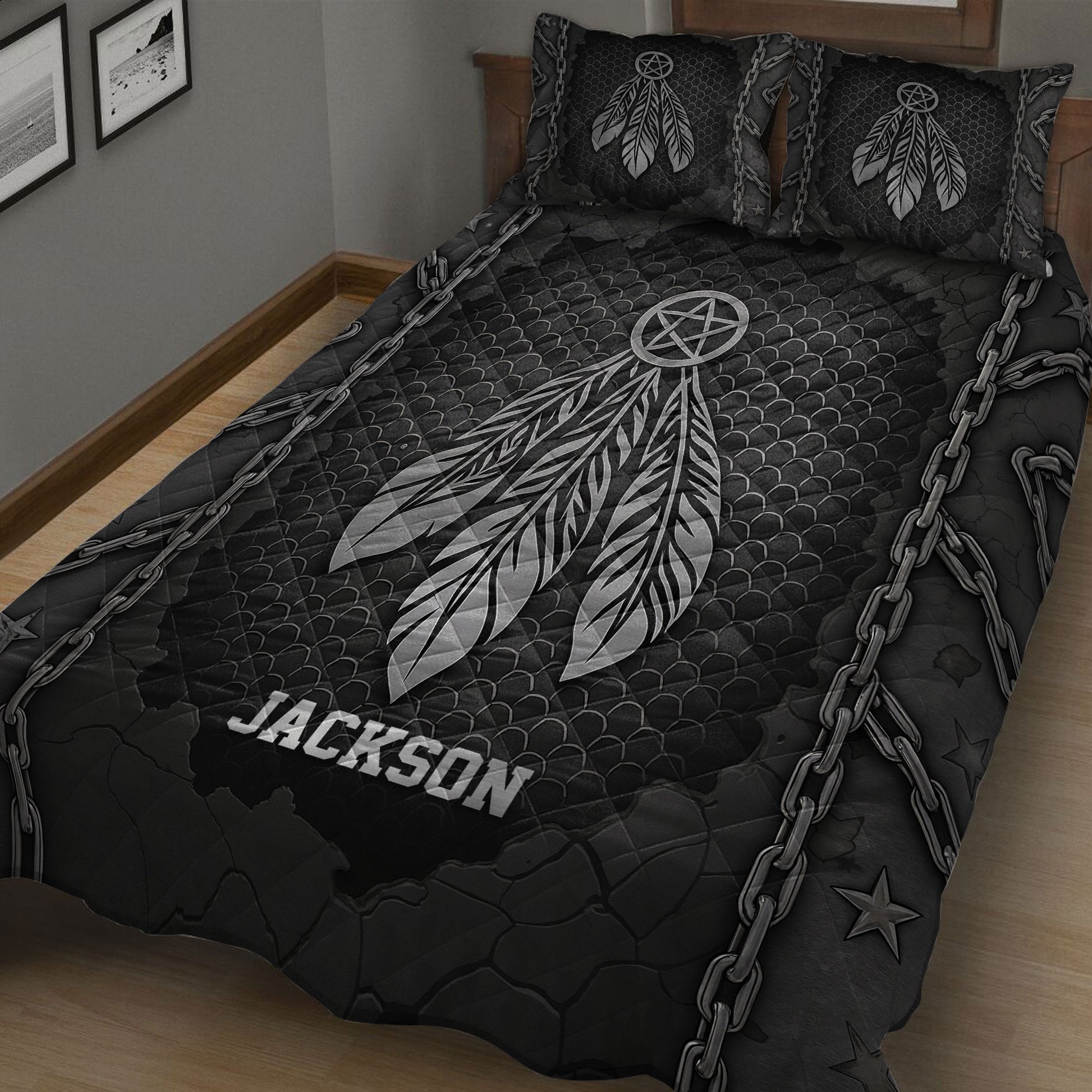 Black Native American quilt blanket displayed on a bed with large silver feathers and dreamcatcher artwork