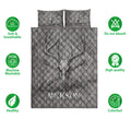 Hunting quilt bedding set flat lay featuring deer skull and antler artwork in a gray design