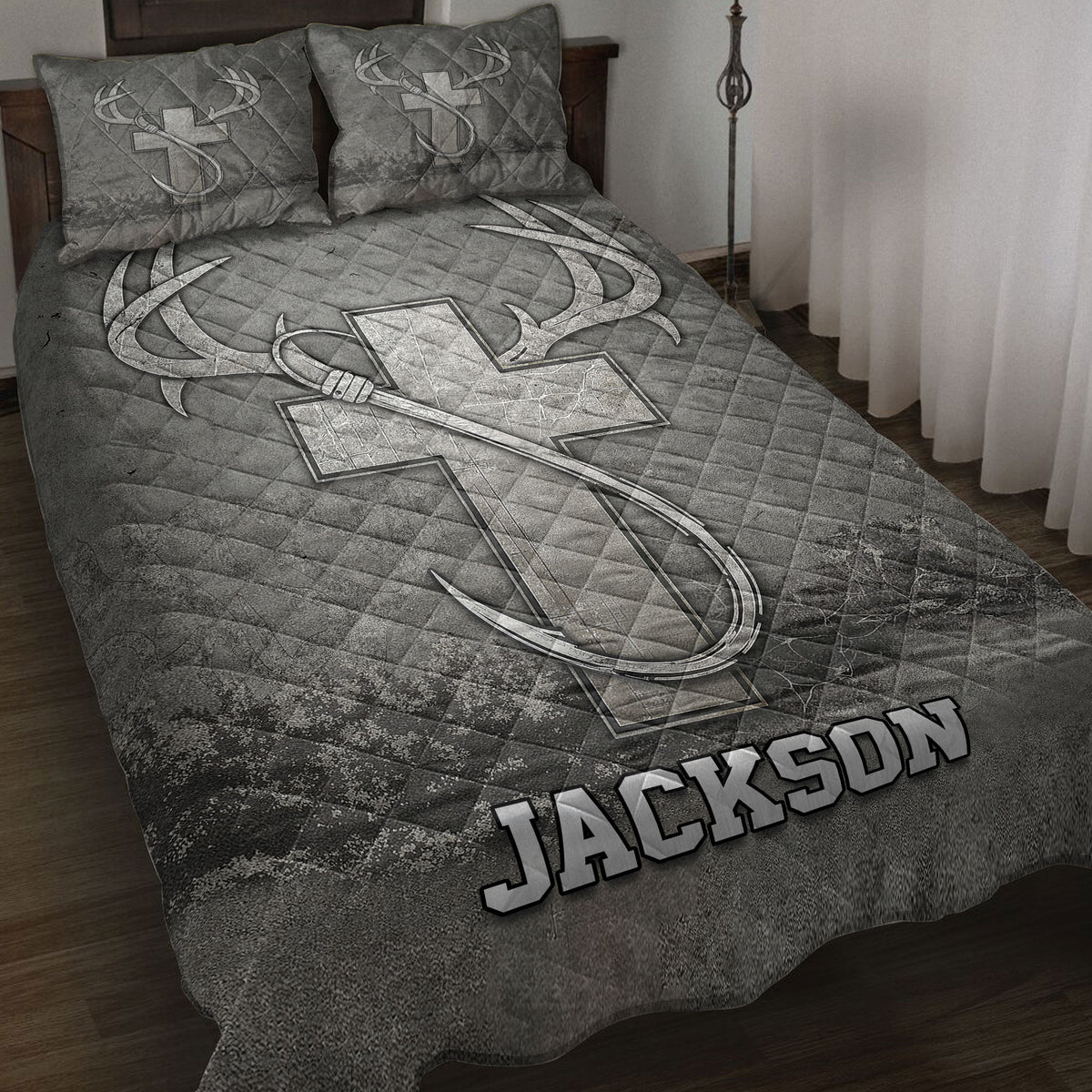 Hunting quilt blanket displayed on a bed with large deer antlers and rustic woodland artwork