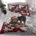 Rottweiler Christmas quilt styled on a bedroom bed with snowy plaid artwork