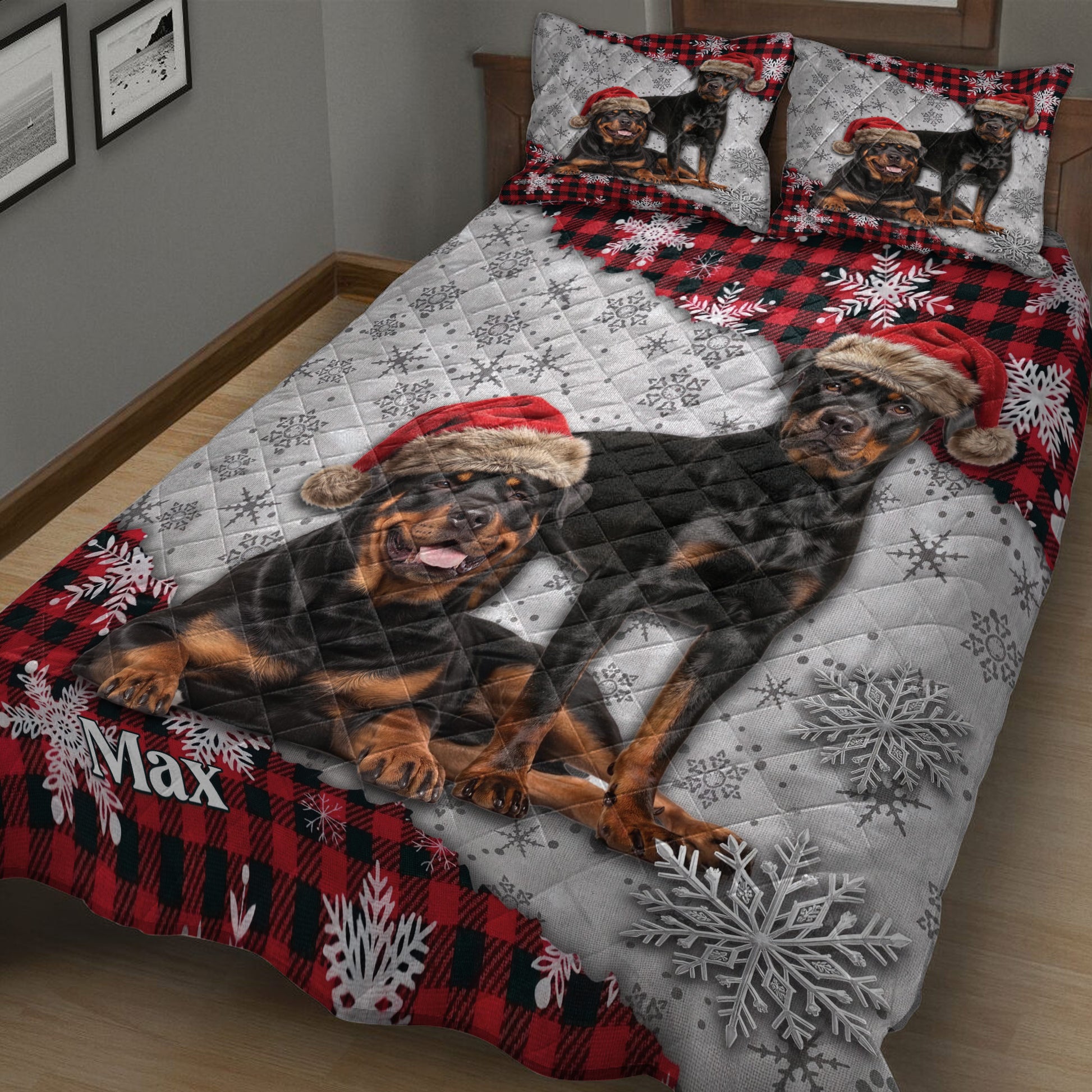 Rottweiler quilt bedding displayed on a bed with Santa hats, snowflakes, and festive red plaid