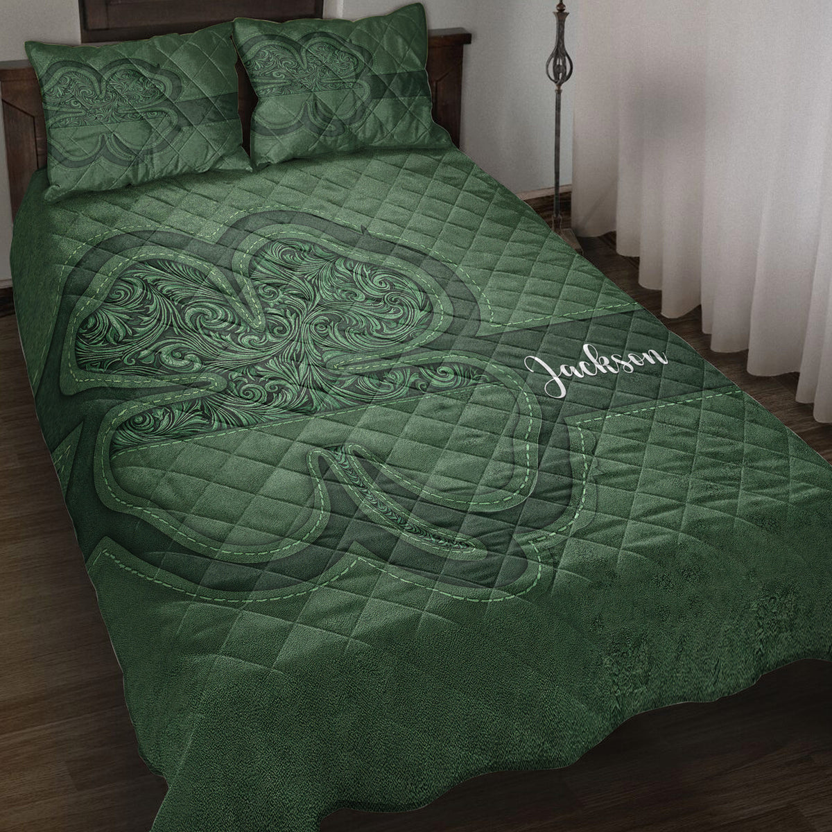 Irish shamrock quilt blanket bedding set in deep green with ornate Celtic-inspired artwork on a bed