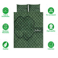 Green Irish shamrock quilt bedding set shown with soft breathable and care feature icons