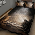 Close bedroom view of a black and gold chess quilt blanket with chess piece artwork