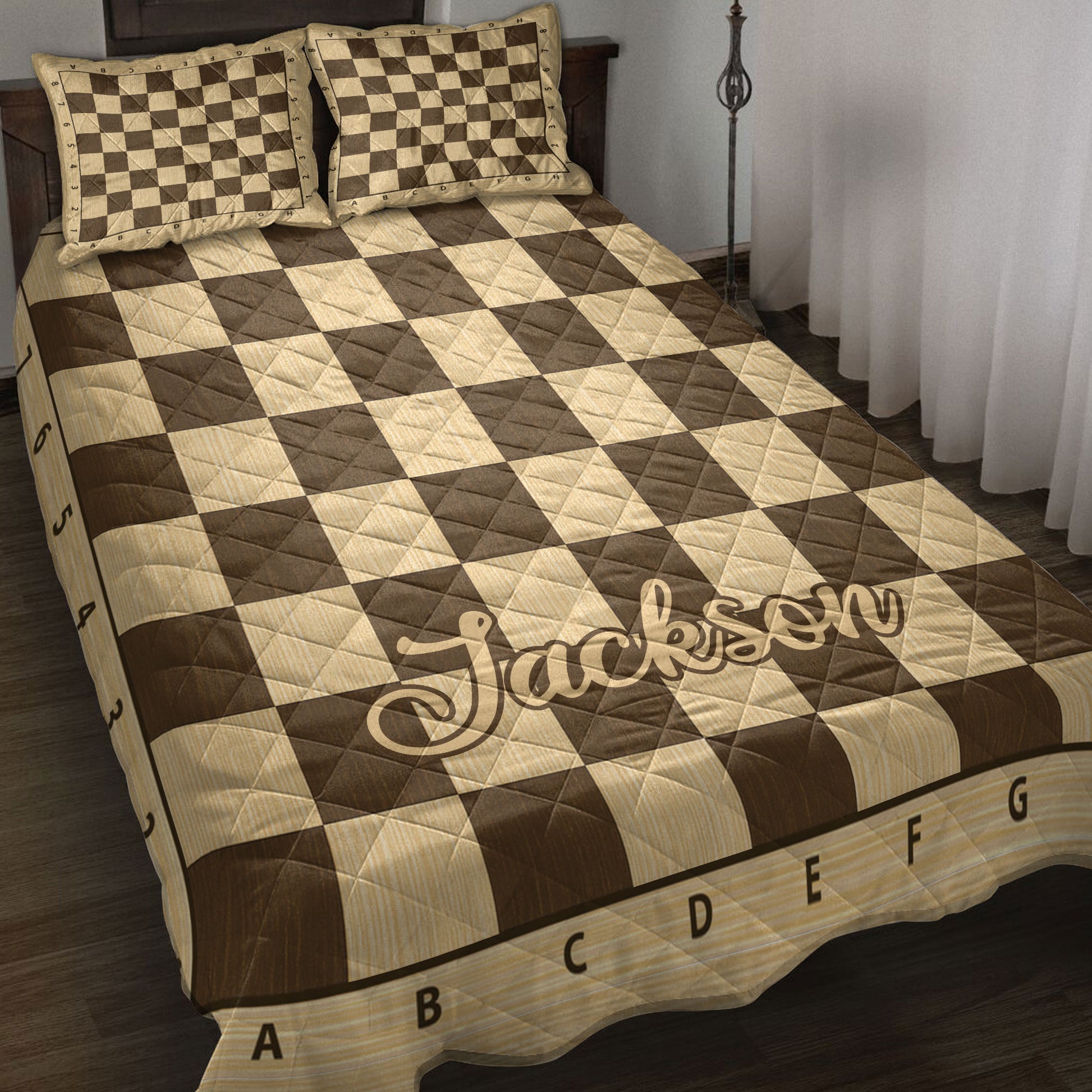 Chessboard quilt blanket in warm brown and tan tones styled on a bedroom bed with matching pillows