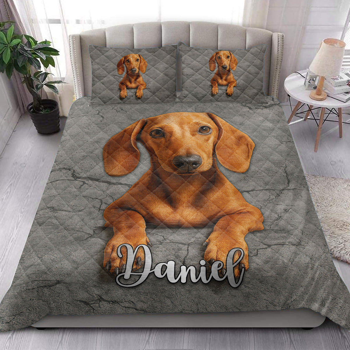 Dachshund quilt blanket styled in a bright bedroom with a large brown dog portrait across the bed