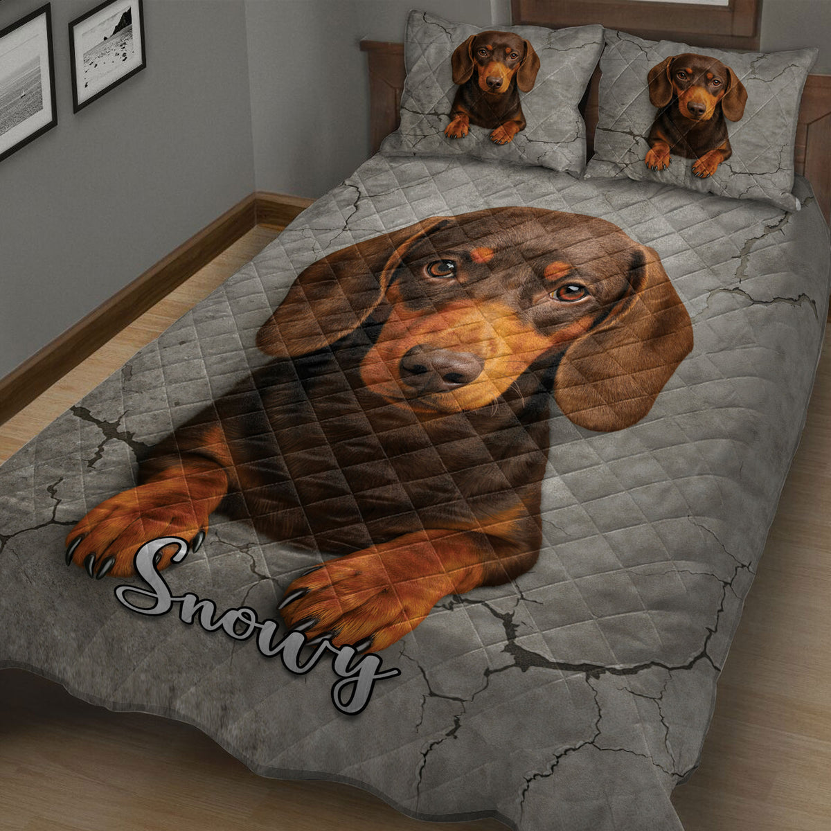 Close angled view of dachshund quilt bedding with a warm brown dog portrait and gray cracked-stone pattern