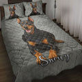 Doberman quilt blanket spread across a bedroom with matching dog artwork on the pillows