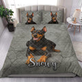 Doberman quilt bedding set styled on a modern bed with bold gray dog artwork