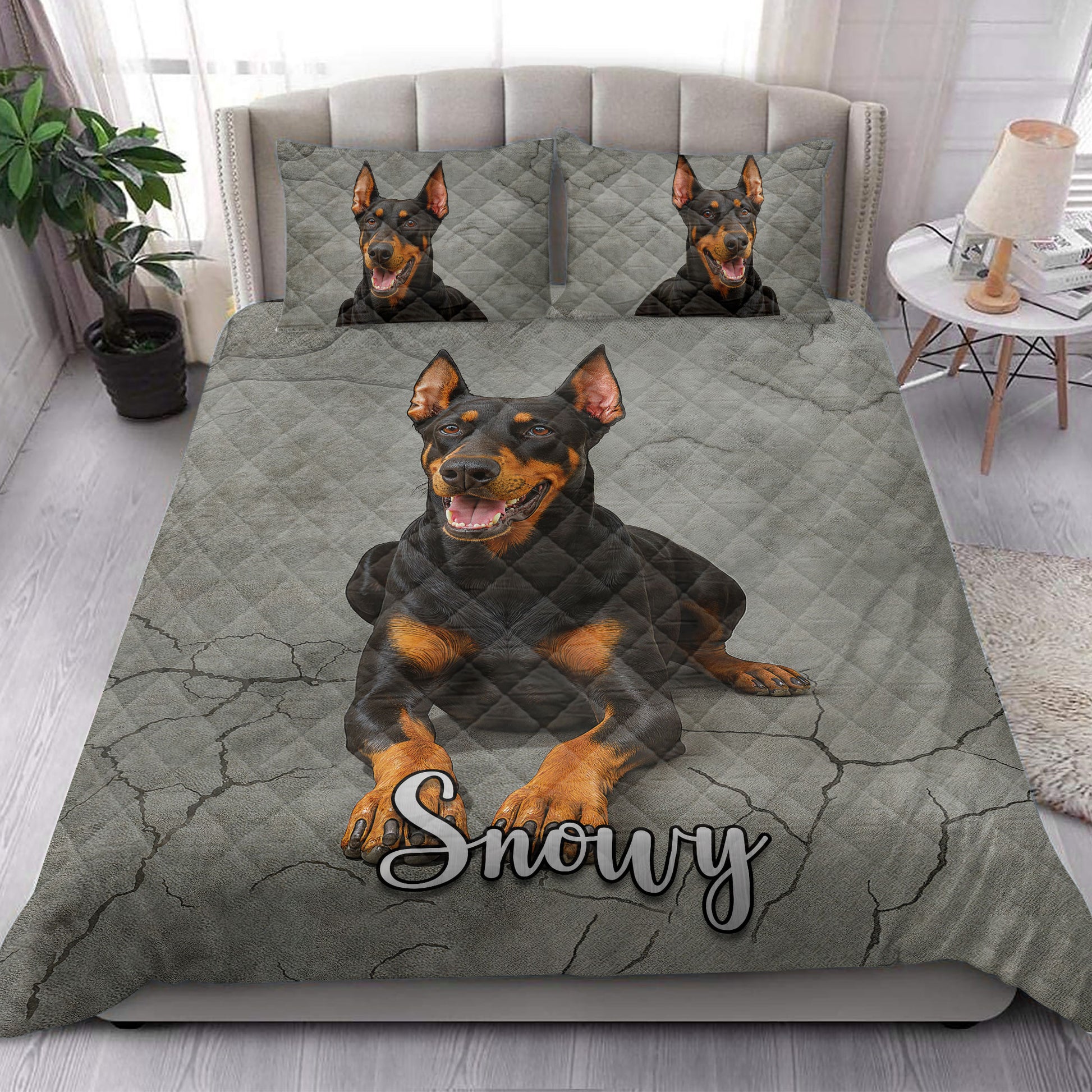 Doberman quilt bedding set styled on a modern bed with bold gray dog artwork