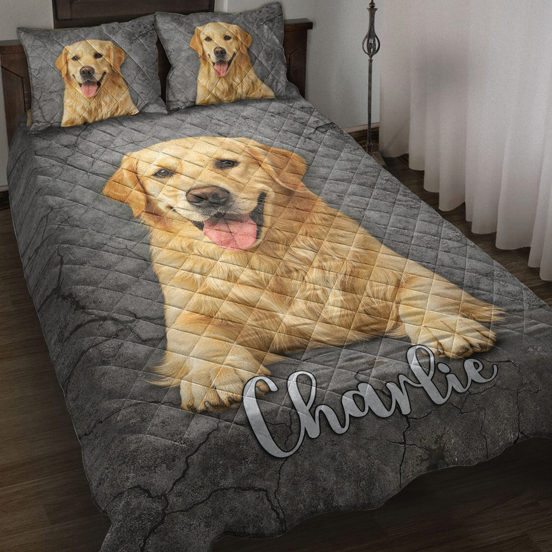 Golden Retriever quilt blanket displayed on a bed with three cheerful dog portraits and dark gray cracked-stone artwork