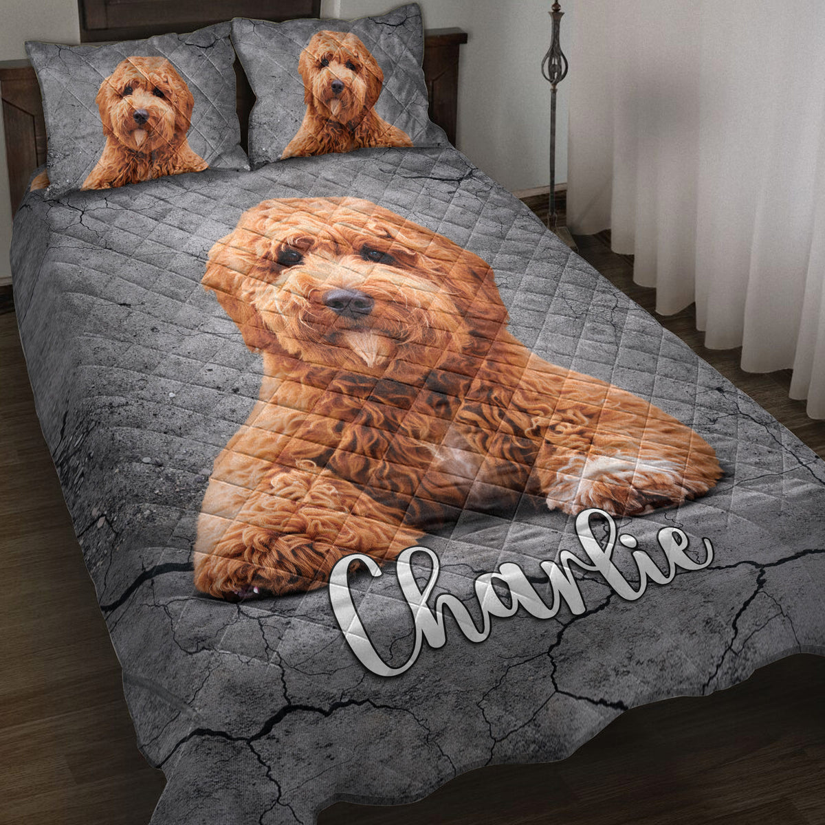 Poodle quilt blanket displayed on a bed with matching dog portraits on the pillows