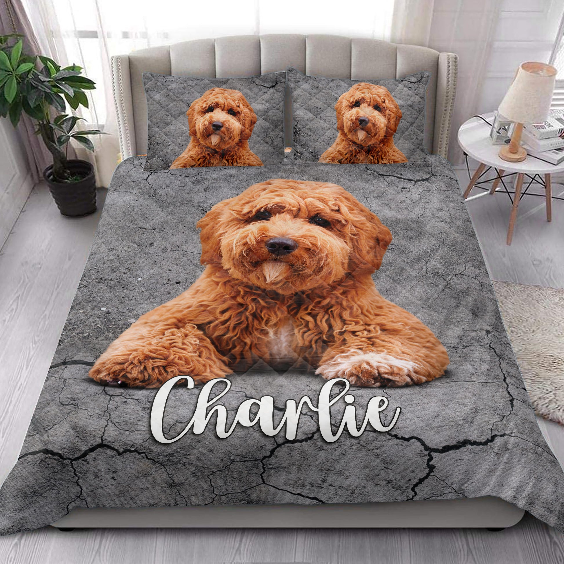 Poodle quilt blanket styled in a bright bedroom with large dog artwork