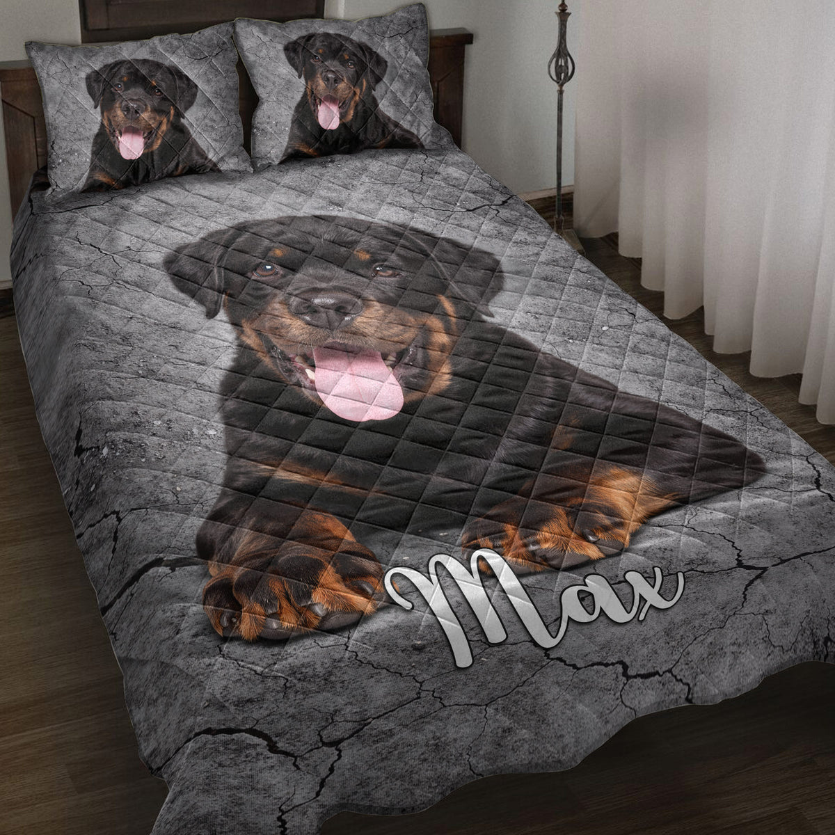 Rottweiler quilt blanket displayed on a bed with matching dog portrait pillow designs and gray cracked-stone artwork