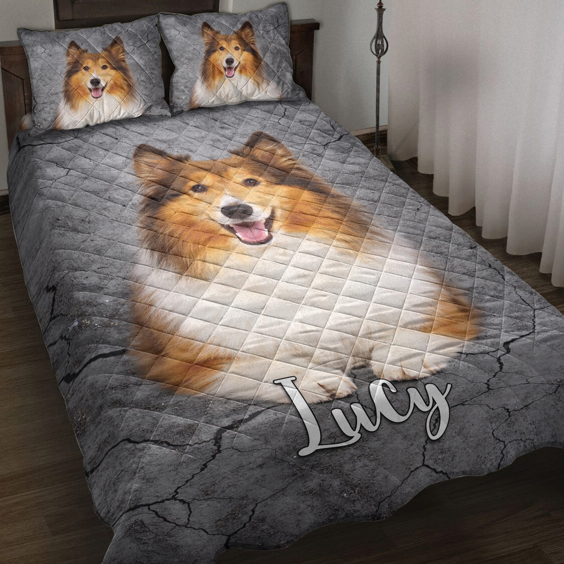 Rough Collie quilt blanket displayed on a bed with matching dog artwork and gray cracked-stone background