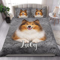 Rough Collie quilt blanket styled in a bright bedroom with large dog artwork across the bed