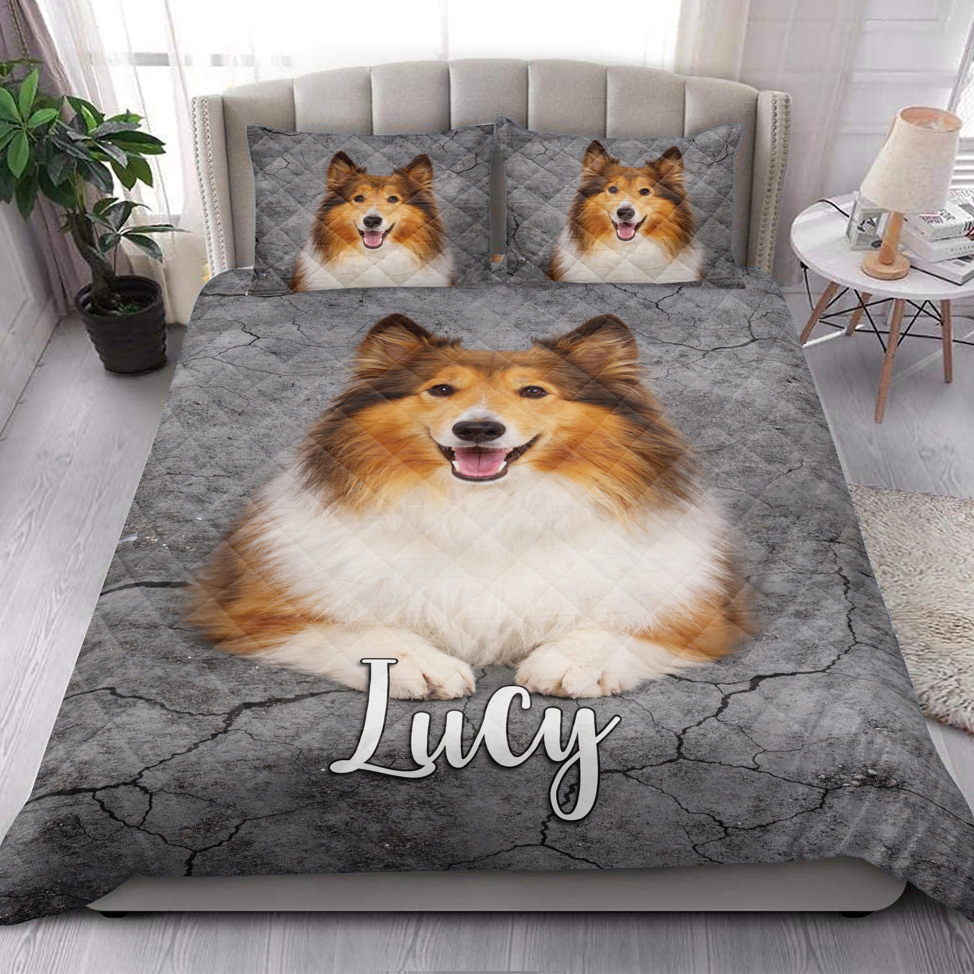 Rough Collie quilt blanket styled in a bright bedroom with large dog artwork across the bed