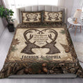 Rustic hunting quilt blanket styled in a bright bedroom with deer antlers, pine branches, acorns, and camouflage