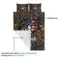 Hunting quilt construction view showing the printed antler and deer skull design with a quilted white backing