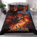 Pirate quilt bedding styled in a bright bedroom with skull, anchor, crossed bones, and fiery nautical artwork