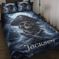 Pirate quilt blanket displayed on a bed with skull captain artwork, ships, crossed swords, and dark blue ocean scenery