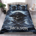Pirate quilt blanket styled in a bedroom with skull captain artwork, moonlit ships, crossed swords, and blue ocean tones