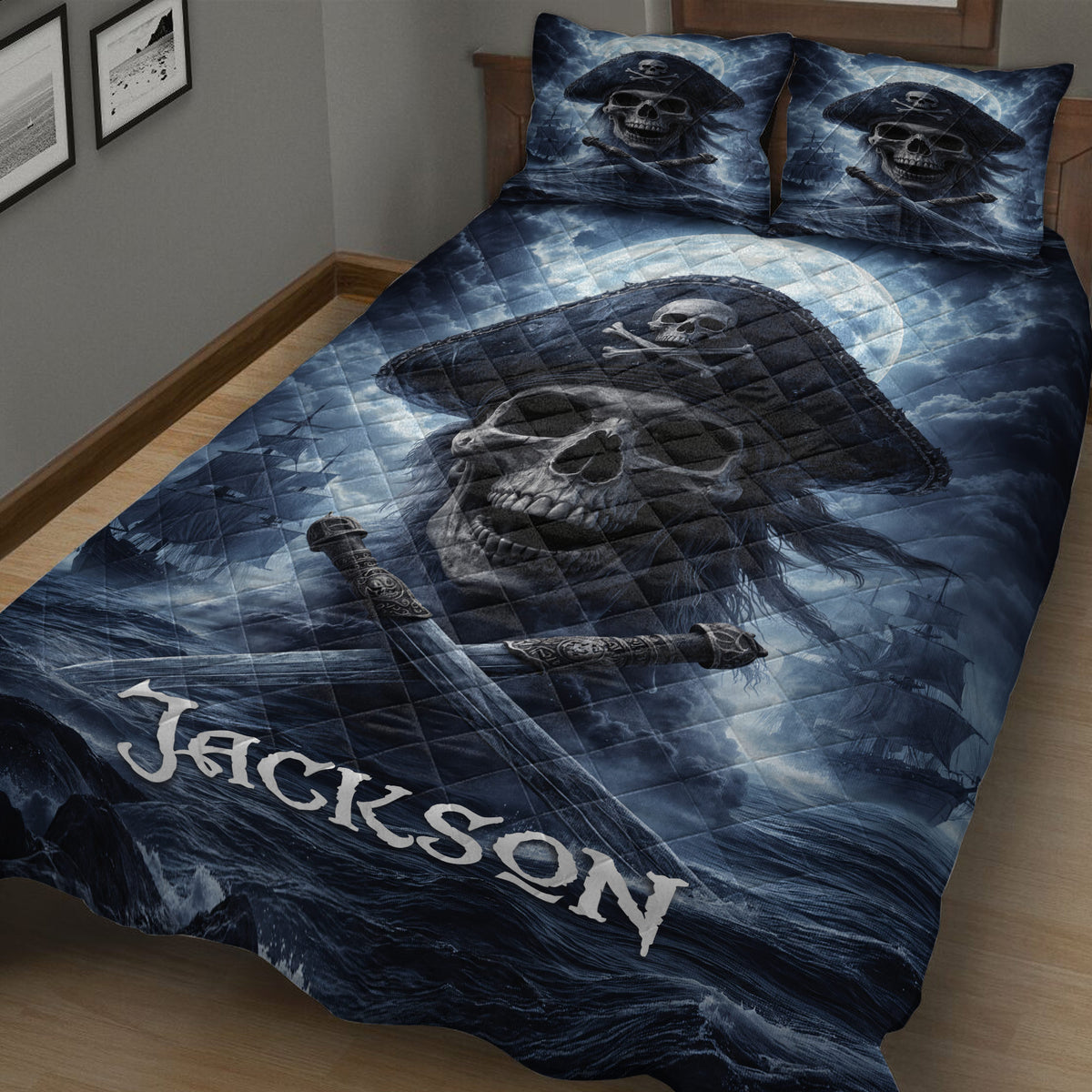 Close view of pirate quilt bedding with skull captain artwork, pirate ships, crossed swords, and stormy blue waves