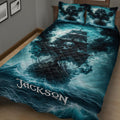 Close bedroom view of a pirate ship quilt blanket with skull artwork, ocean waves, and storm clouds