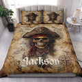 Pirate quilt blanket styled in a bright bedroom with skull captain artwork, map details, and nautical compass accents