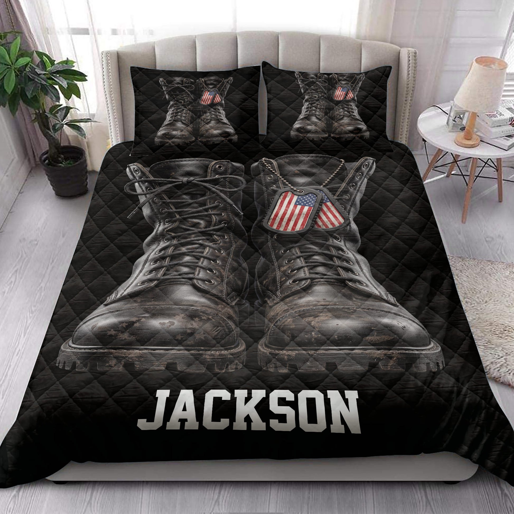Military veteran quilt bedding styled on a bed with oversized combat boot artwork