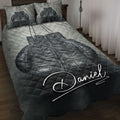 Black boxing gloves quilt blanket styled on a bedroom bed with matching boxing artwork