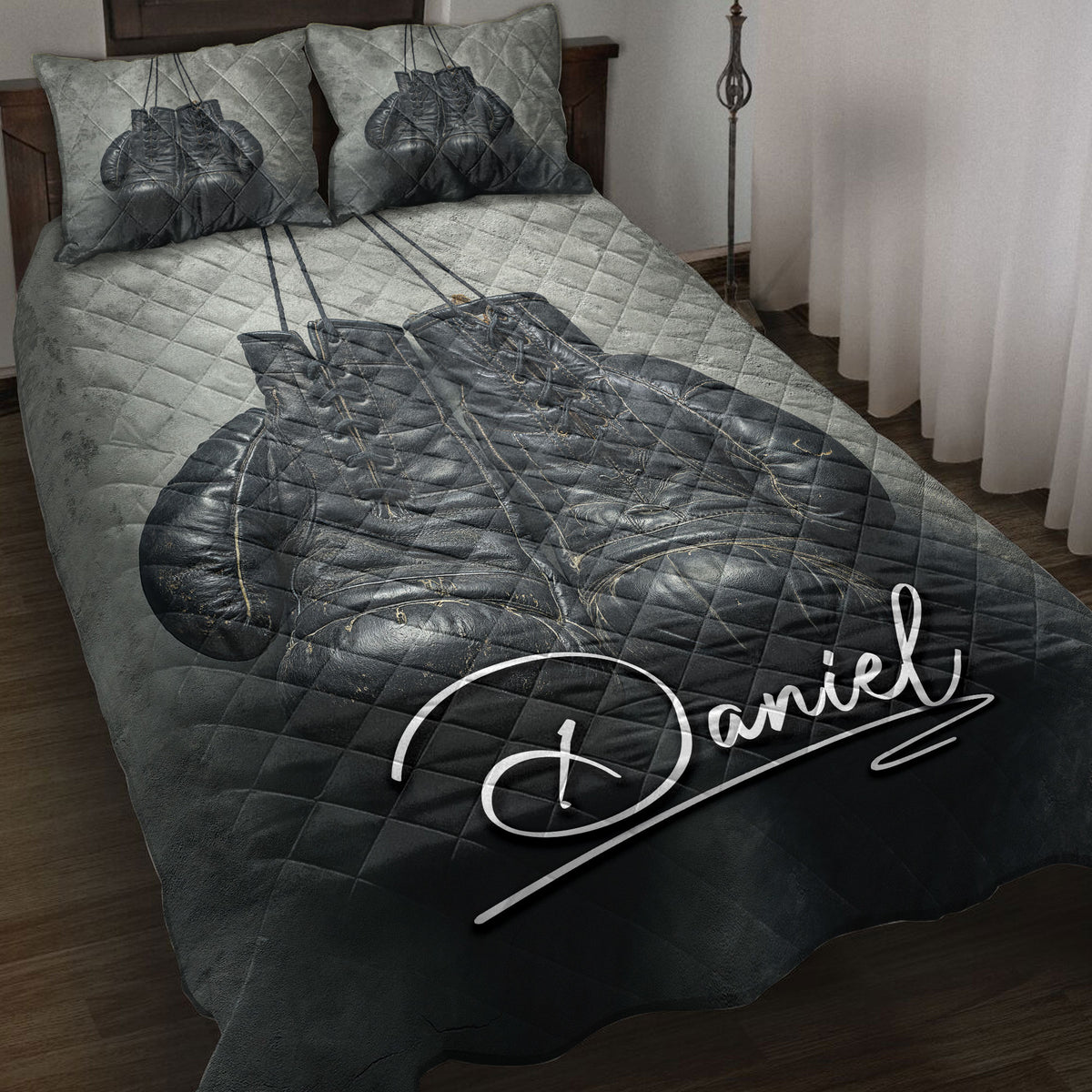 Black boxing gloves quilt blanket styled on a bedroom bed with matching boxing artwork