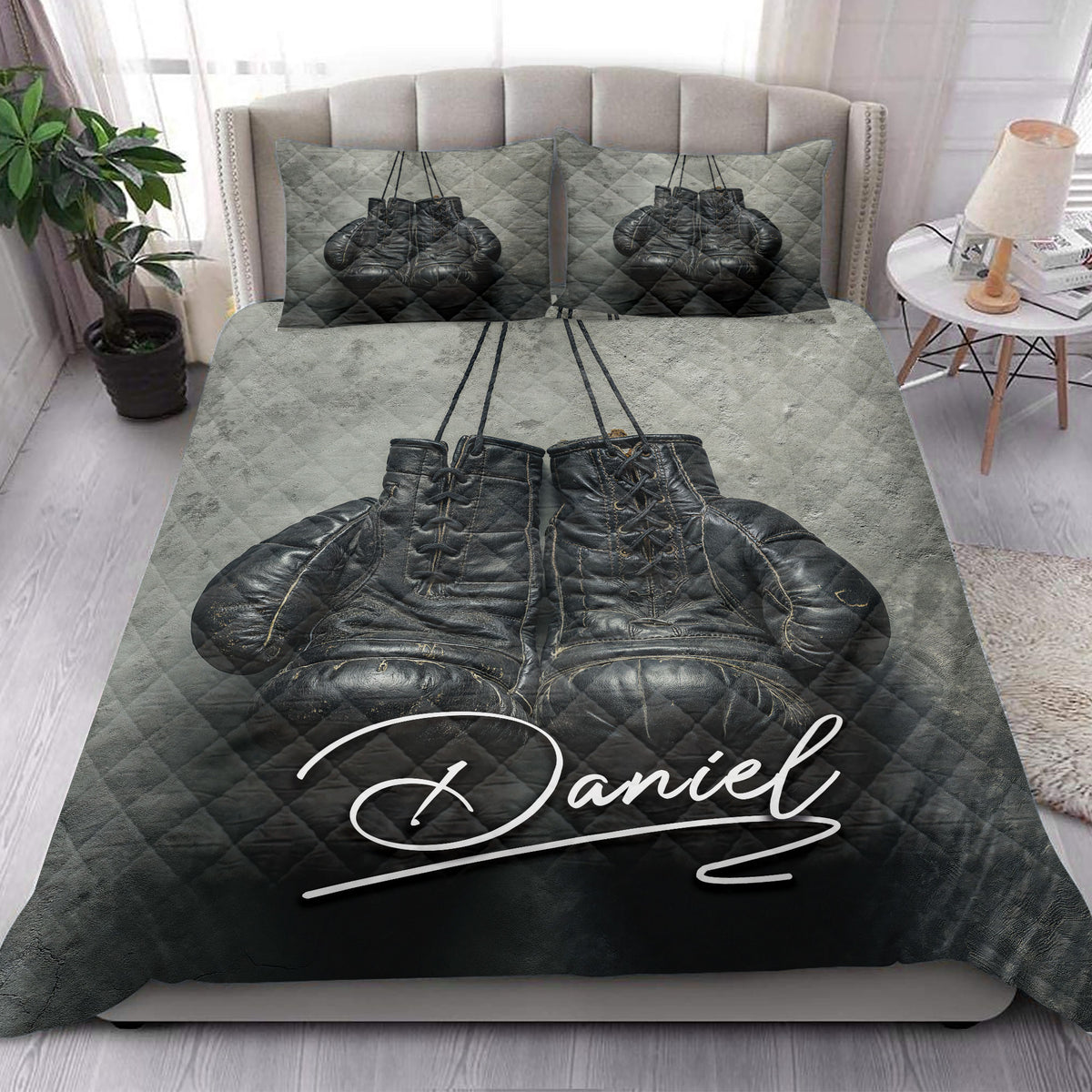 Boxing gloves quilt blanket displayed across a modern bed in a bright bedroom