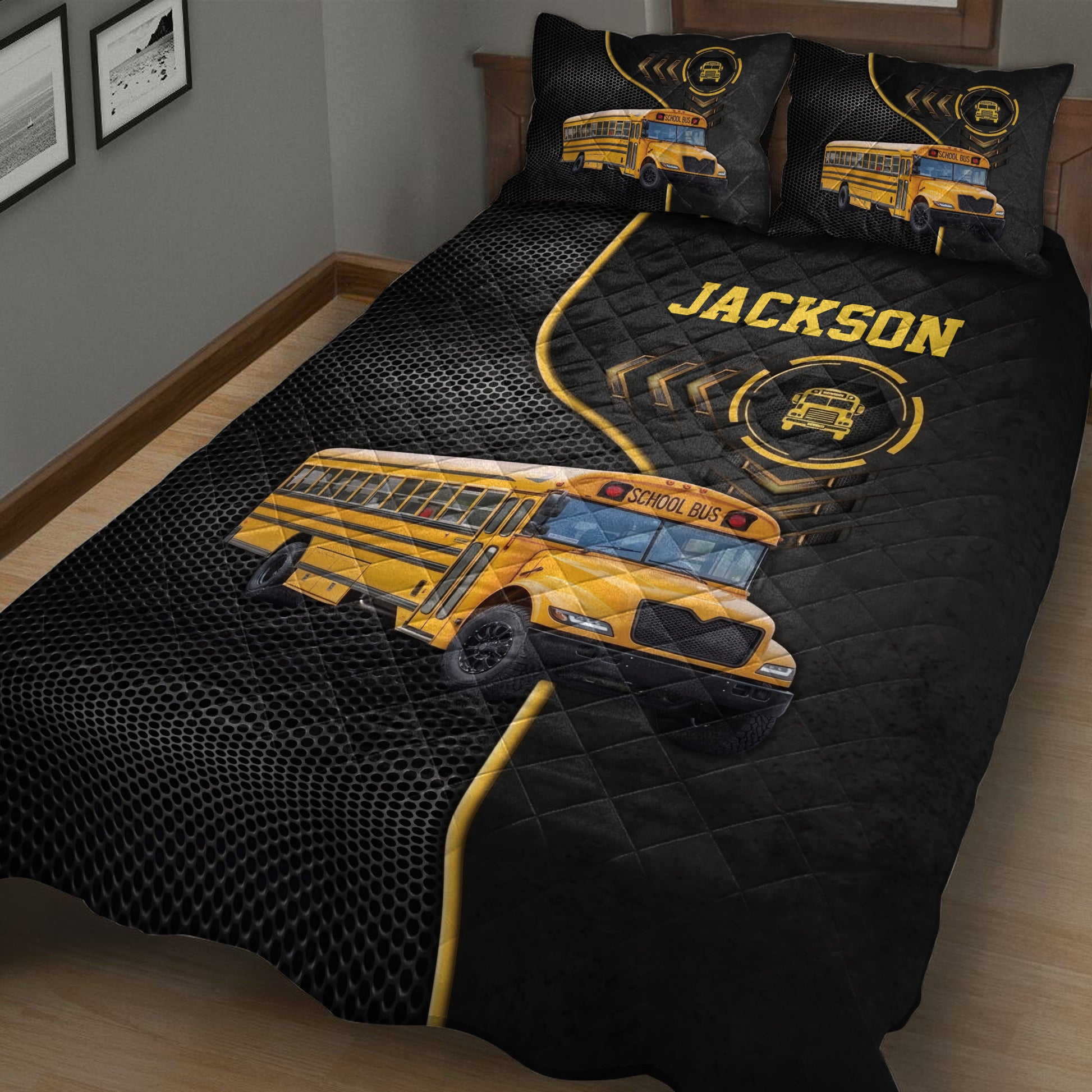 School bus quilt blanket displayed in a bedroom with large yellow bus artwork and black geometric background