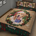 Golden Retriever Christmas quilt blanket shown on a bed with Santa hat, presents, pinecones, and seasonal greenery