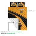 School bus quilt showing printed front artwork, road graphics, bus illustrations, and a white quilted backing