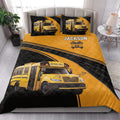 School bus driver quilt blanket styled in a bright bedroom with yellow bus artwork and black road accents