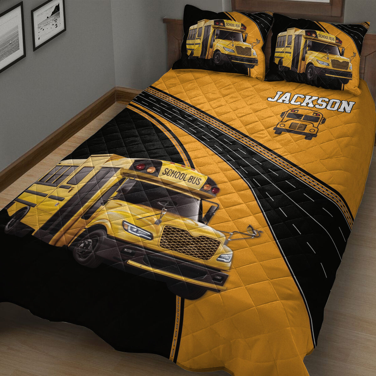 School bus quilt bedding displayed on a bed with large yellow bus artwork, black roads, and coordinating pillow designs
