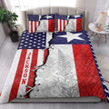 Texas Lone Star quilt bedding set styled in a bright bedroom with floral patriotic artwork