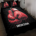 Black boxing quilt blanket displayed on a bed with bold red boxing gloves artwork