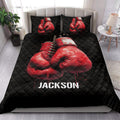Boxing-themed quilt bedding styled in a bedroom with red gloves and black decor