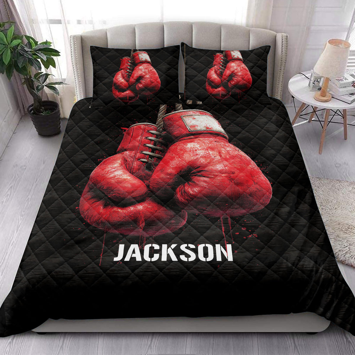 Boxing-themed quilt bedding styled in a bedroom with red gloves and black decor