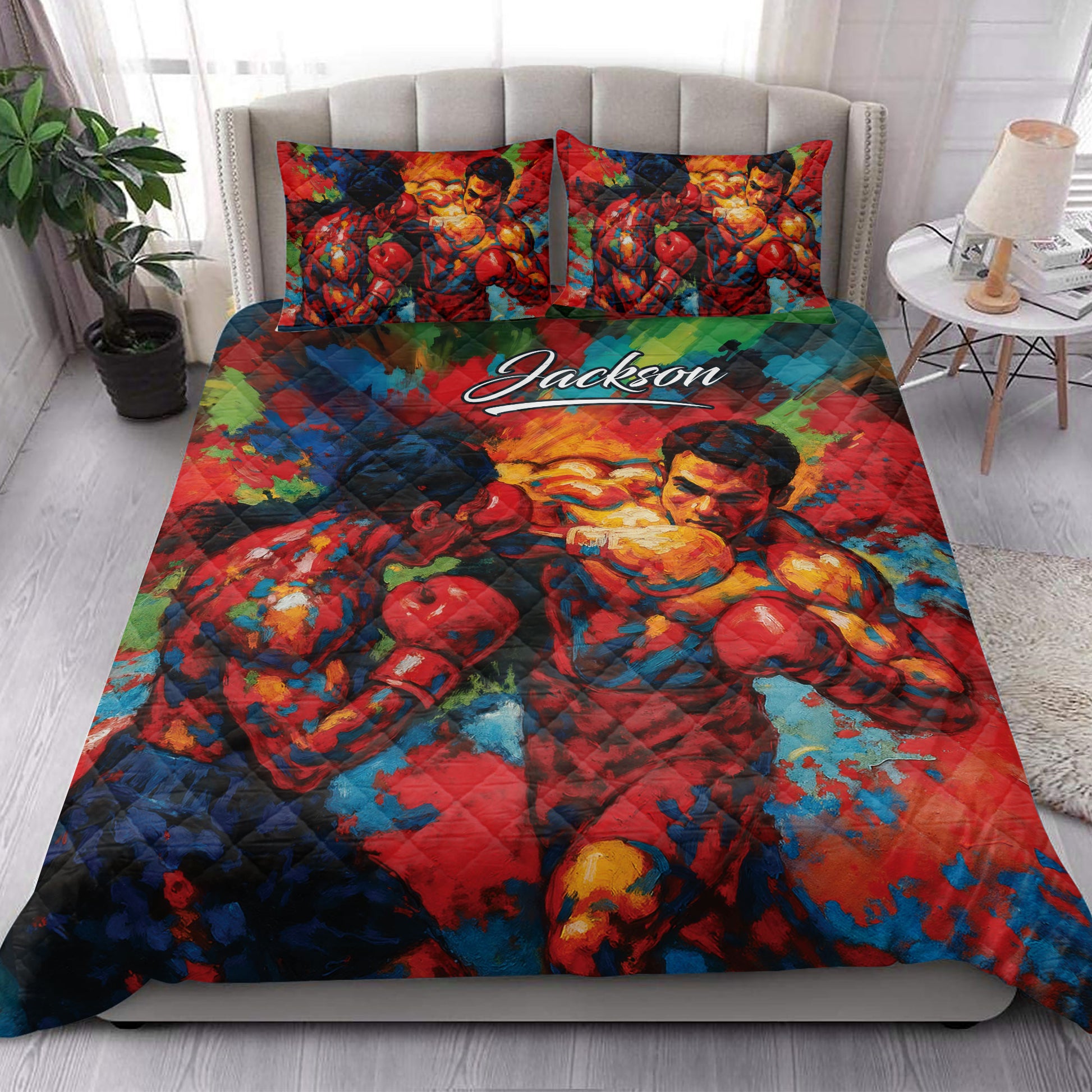 Bright boxing quilt bedding styled in a modern bedroom with boxer and glove artwork