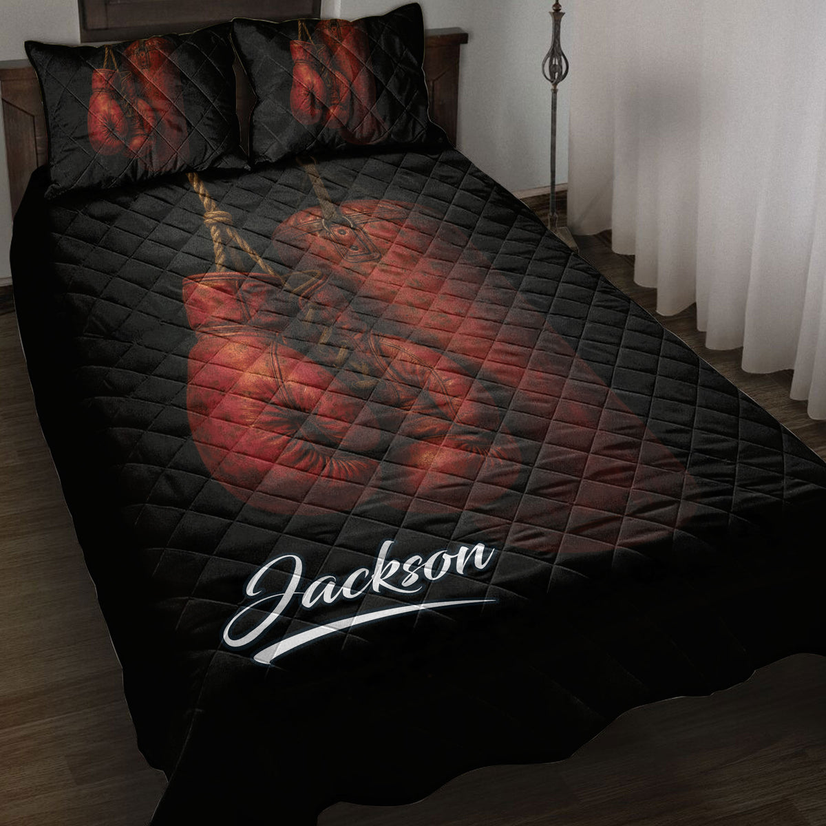 Black boxing quilt blanket displayed on a bed with red boxing gloves and gear artwork
