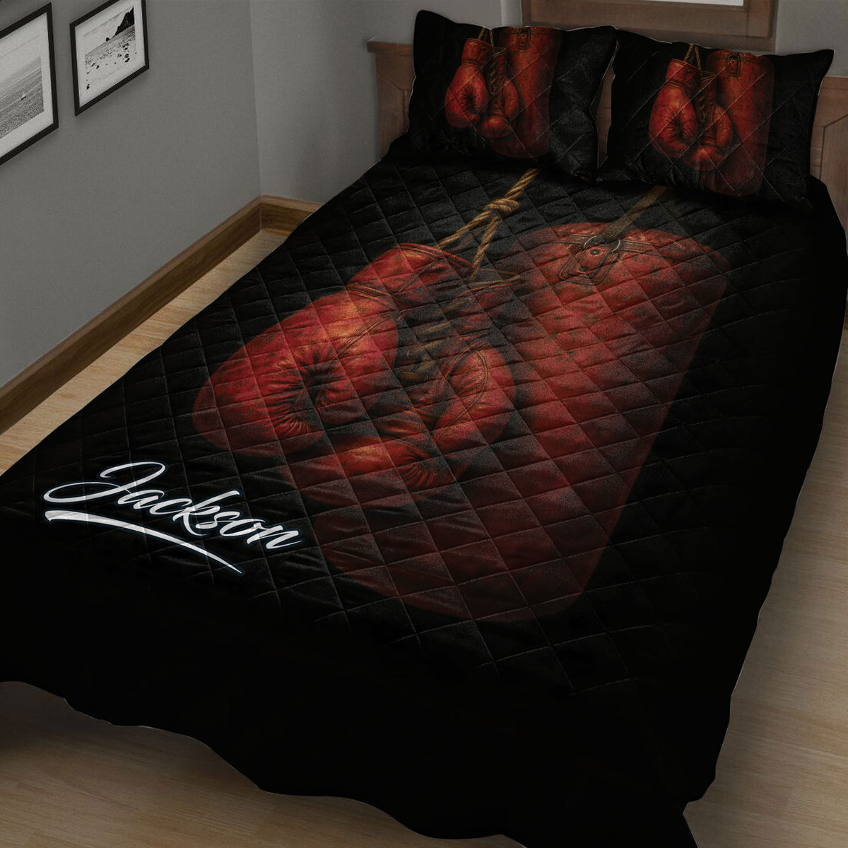 Close bedroom view of a black boxing quilt with dramatic red gloves and boxing gear artwork