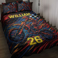 Motocross quilt blanket displayed on a bed with dirt bike rider artwork in red, blue, black, and gold
