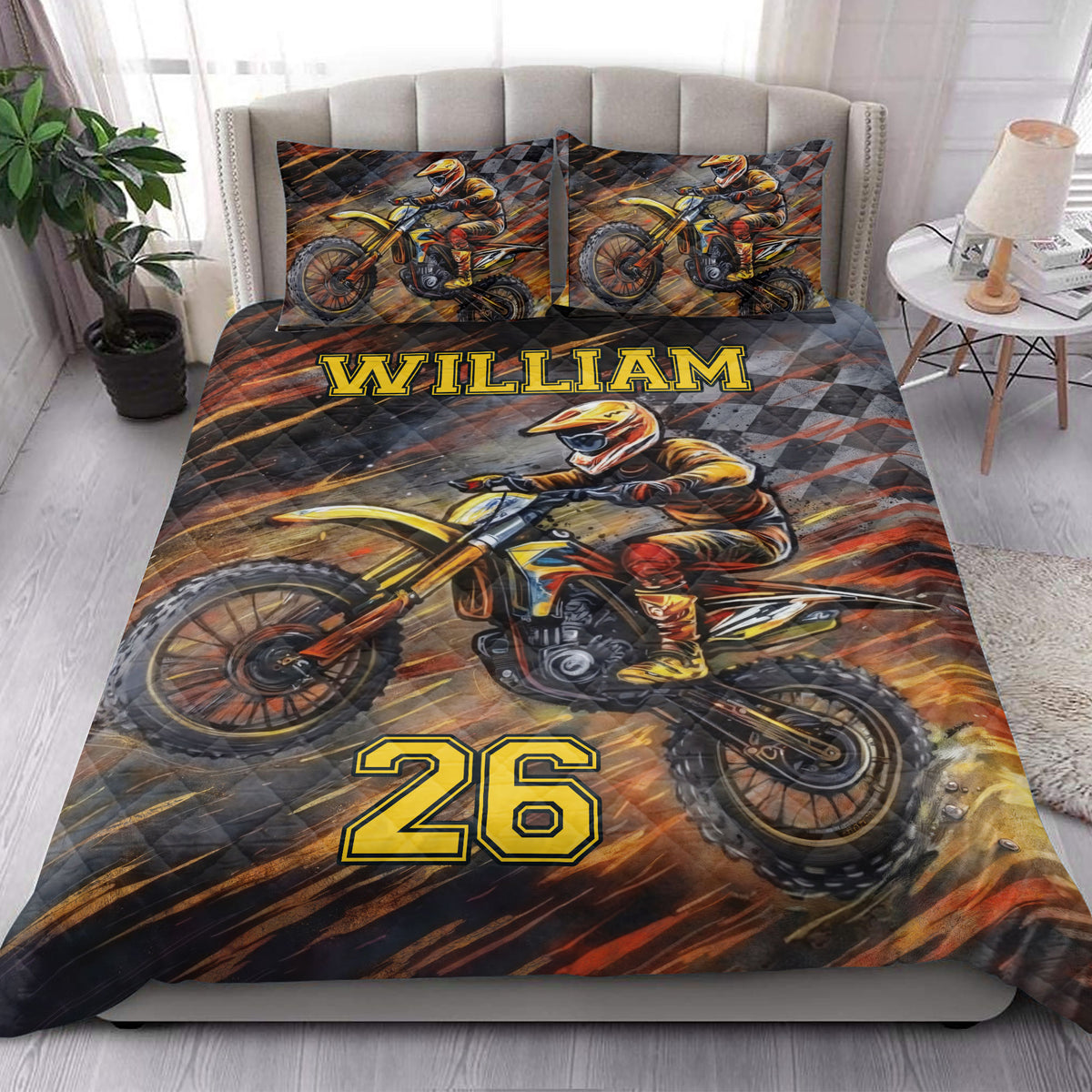 Motocross quilt bedding styled in a bright bedroom with bold dirt bike racing artwork