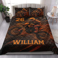 Motocross quilt bedding styled in a bright bedroom with bold orange and black dirt bike artwork