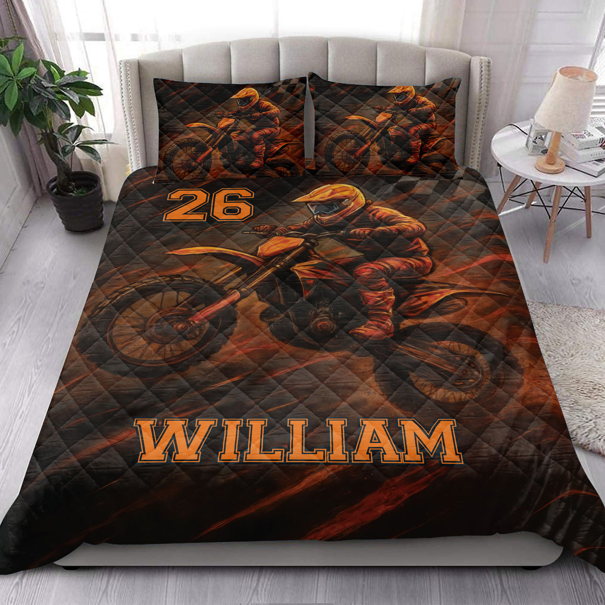 Motocross quilt bedding styled in a bright bedroom with bold orange and black dirt bike artwork